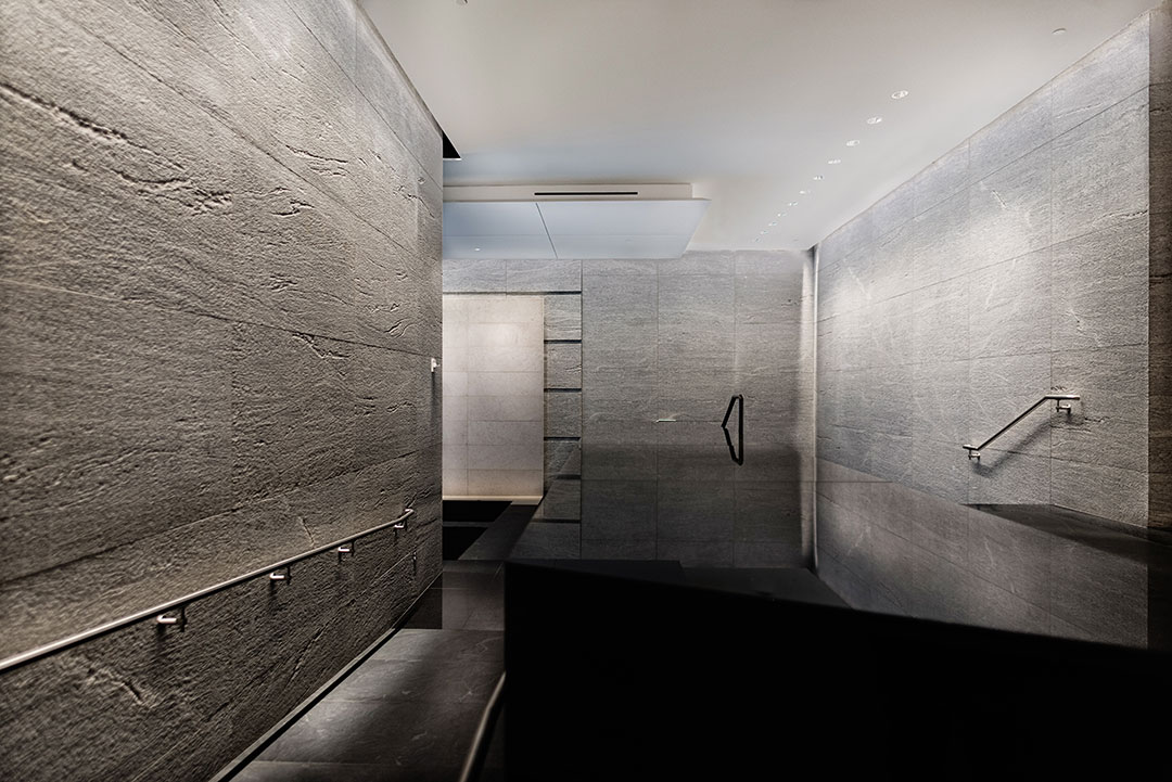 Wide-angle view of the lobby at Rugo Stone's 600 Massachusetts project, highlighting the craftsmanship in stonework and architectural design.