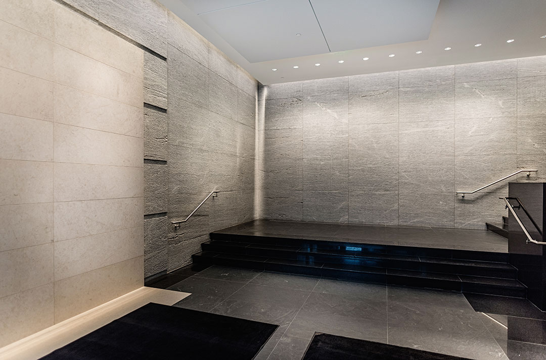 Detailed view of the lobby at Rugo Stone's 600 Massachusetts project, emphasizing the fine stone craftsmanship and architectural features.