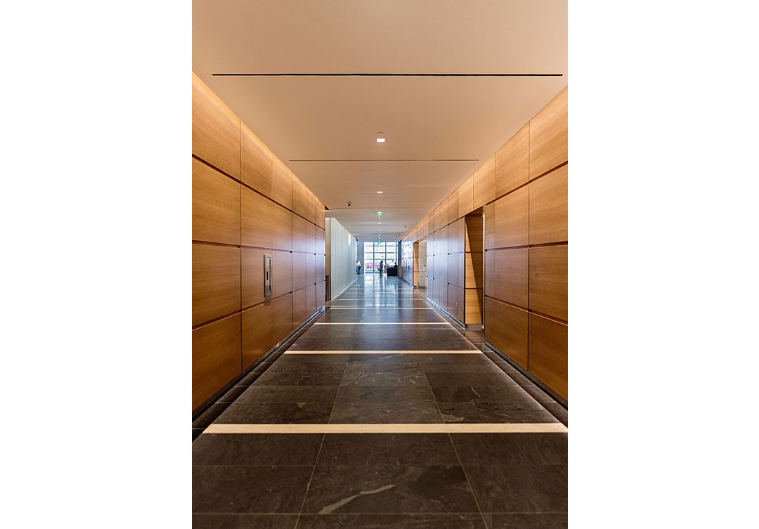 Elegant view of the lobby at Rugo Stone's 600 Massachusetts project, showcasing the detailed stonework and architectural design.