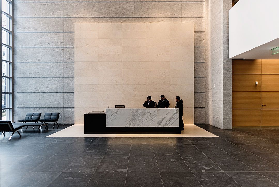Elegant view of the lobby at Rugo Stone's 600 Massachusetts project, showcasing intricate stonework and architectural design.