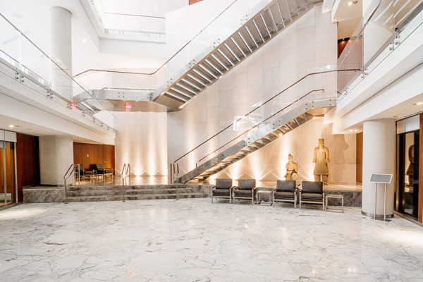 Close-up View Of The Rugo Stone CSIS Project, Showcasing Intricate Stonework And Architectural Detailing.