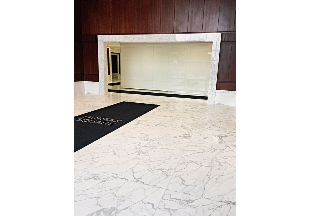 View of the Rugo Stone Fairfax Square project, highlighting the fine craftsmanship in stonework and architectural design.