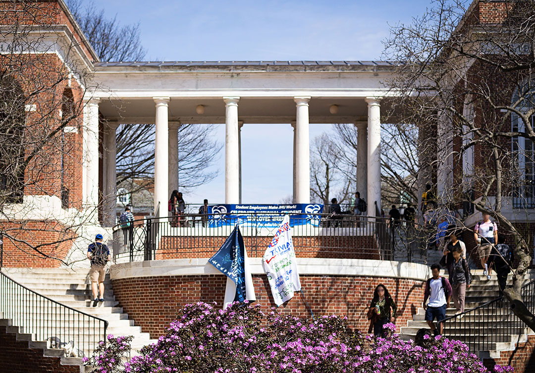 Side view of John Hopkins Krieger Hall, highlighting its modern architectural design and expansive glass panels.