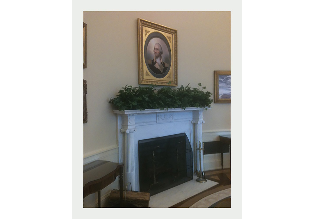 Oval Office fireplace at the George Bush Library, highlighting intricate stone carvings and elegant craftsmanship.