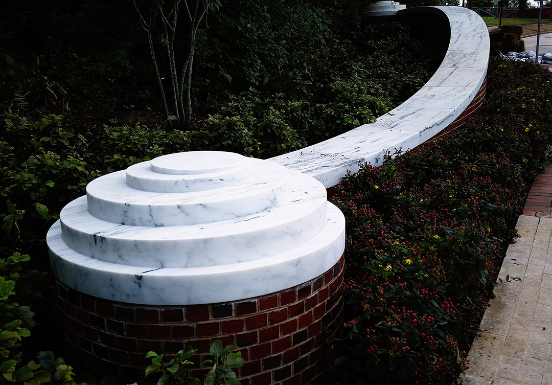 Quiet corner of the Decker Quad at Johns Hopkins University, with benches and a view of the surrounding historic architecture.