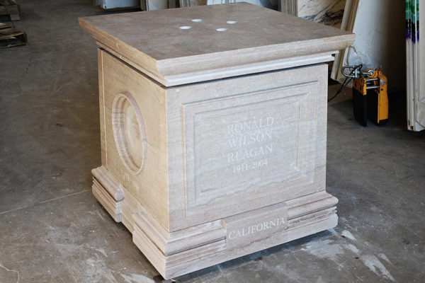 Base Of The Ronald Reagan Statue At The U.S. Capitol, Featuring Detailed Stone Carving And Architectural Design.