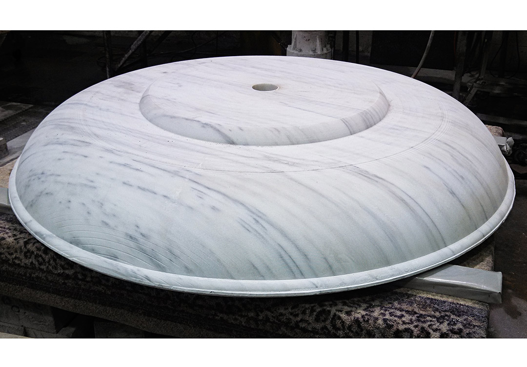 Exquisite stone water fountain at the Trone Residence, showcasing intricate detailing and masterful craftsmanship.