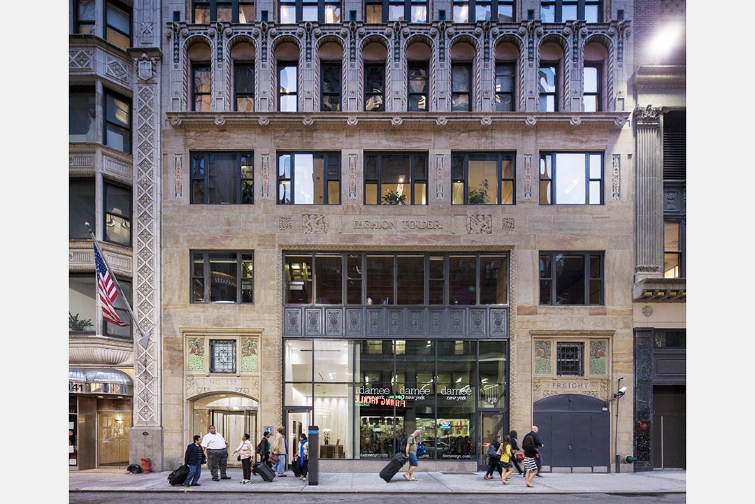Fashion Tower project featuring detailed stonework and expert craftsmanship in architectural design.