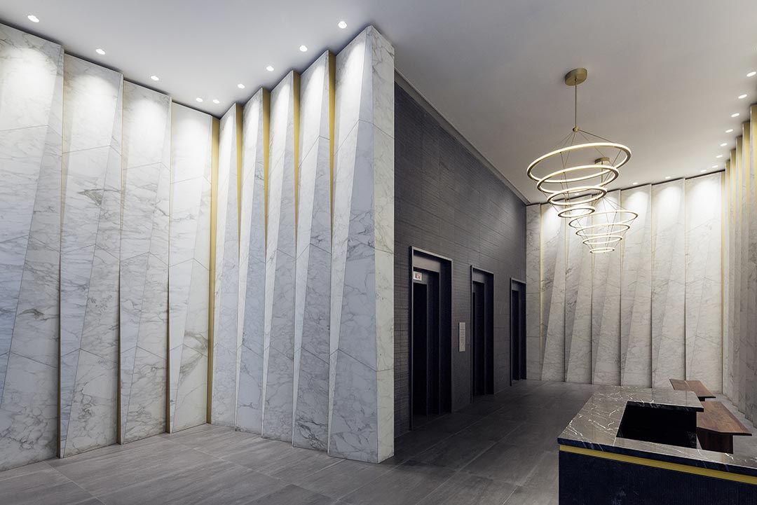 Fashion Tower project showcasing fine stonework with detailed carvings and exceptional craftsmanship in architectural design.