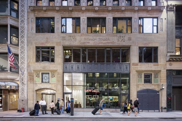 Fashion Tower Project Header Showcasing Custom Stonework And Intricate Architectural Design.