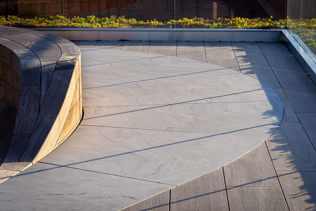 Custom exterior stonework at 1700 Penn, highlighting intricate carvings and expert craftsmanship in architectural design.