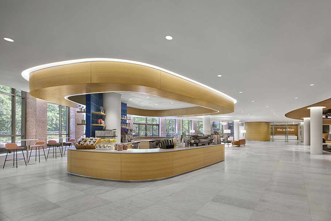 Refined stonework in private office lobby, showcasing intricate detailing and high-quality craftsmanship in architectural design.