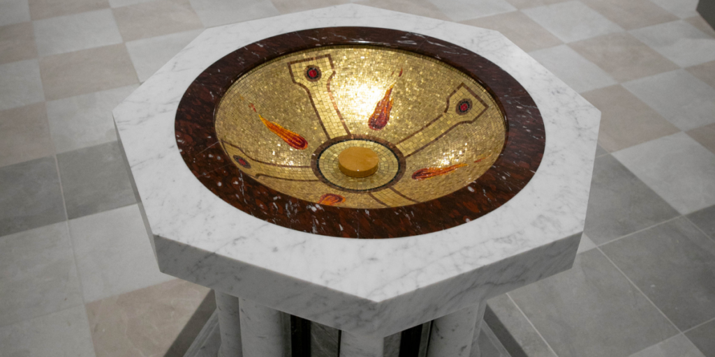 Baptismal fonts showcasing elegant stone craftsmanship and intricate religious design elements